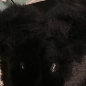BLACK FLUFFY SLIP ONS